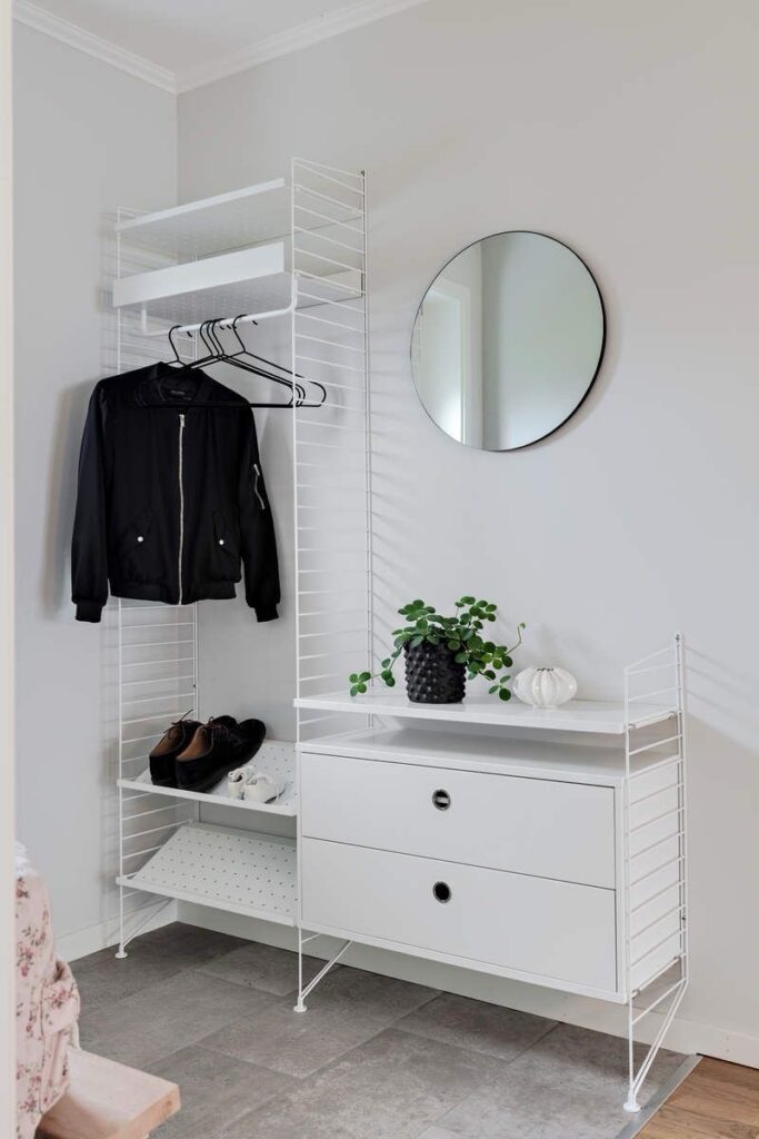 Hallway/Entry with string shelf system and jacket hanging
